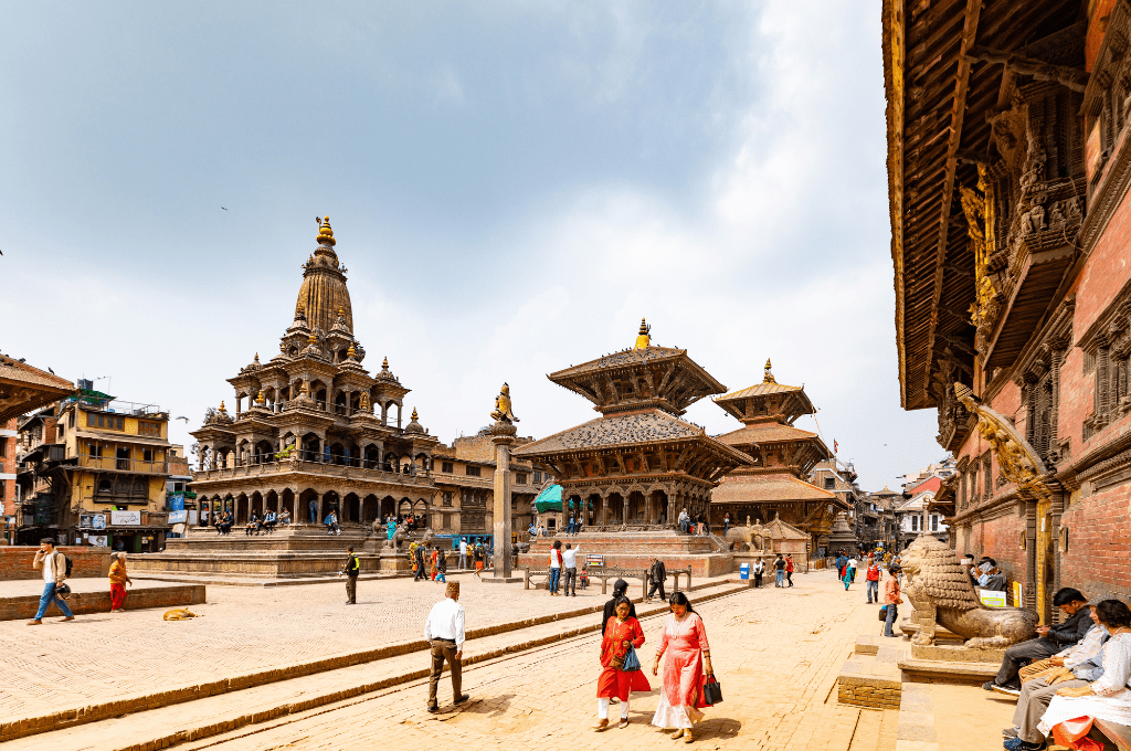 10 Reasons to Visit Nepal In 2024 5 Tourists Sightseeing on Patan Durbar Square in Nepal visit nepal 10 Reasons to Visit Nepal In 2024